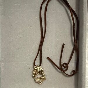 Gold Pendant on Brown Leather Necklace
